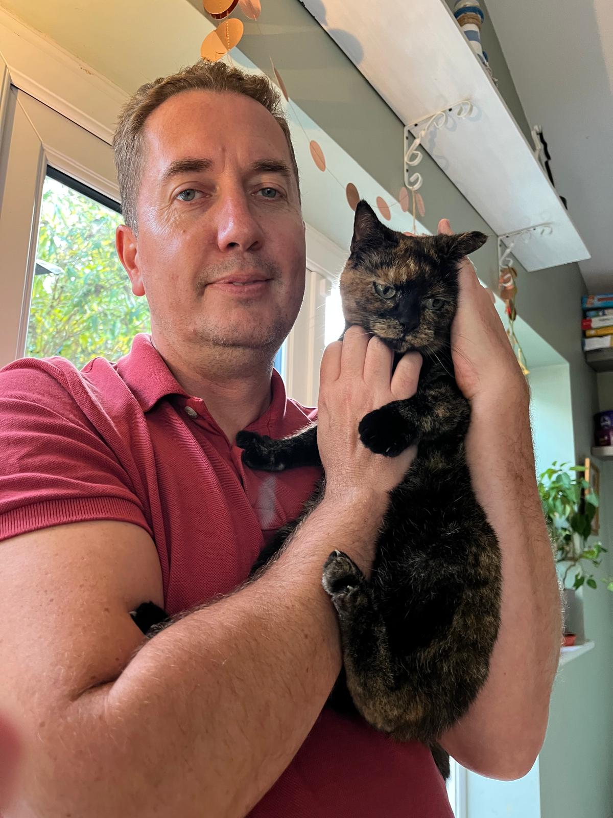 James, the cat feeder behind Wolfiecats Cat Feeding, with Loula